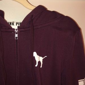 A maroon zip up hoodie